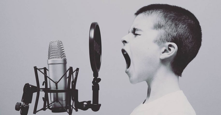 girl shouting into a microphone